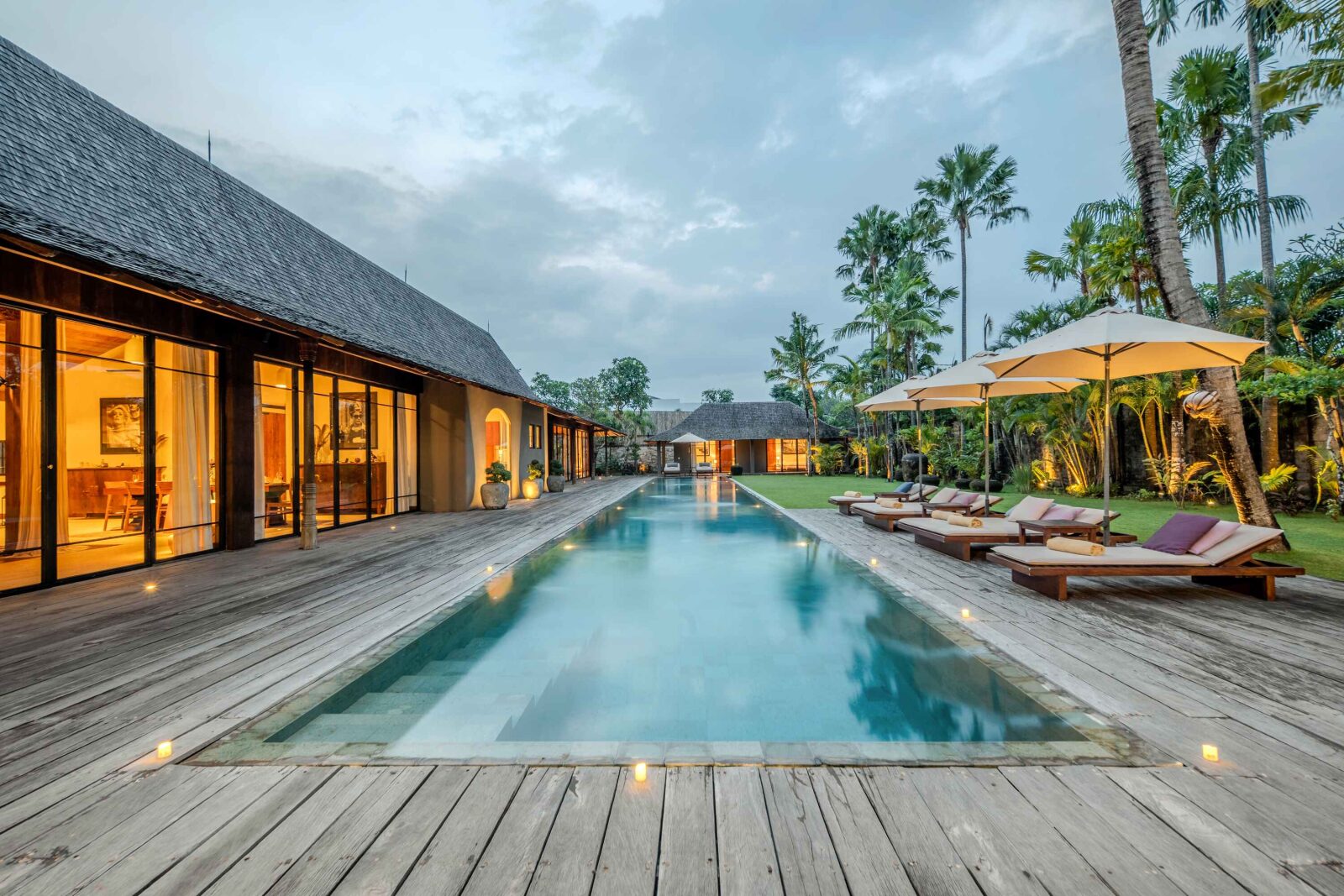 The lap pool lit at dusk