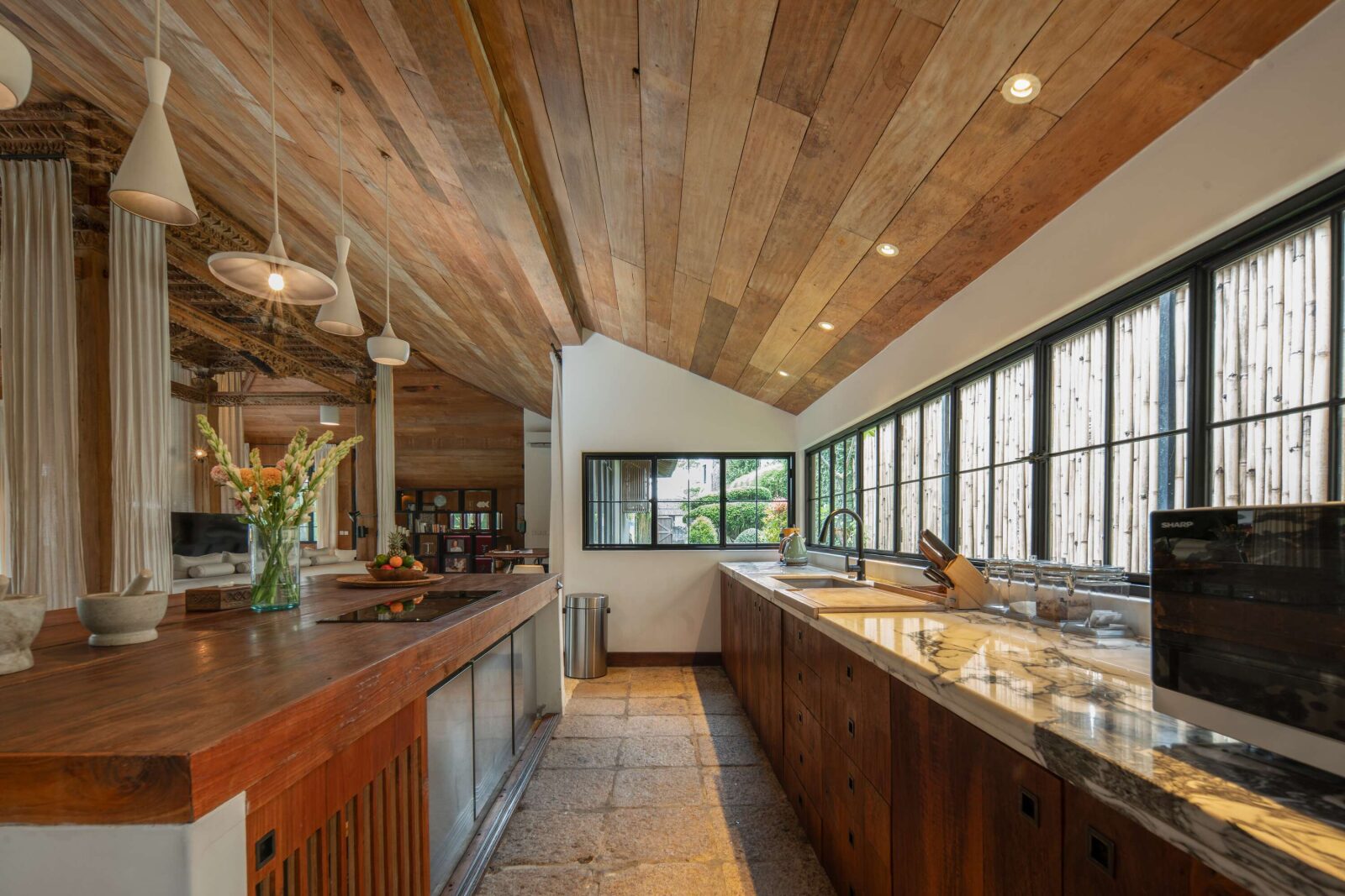 The kitchen island and its teak counter