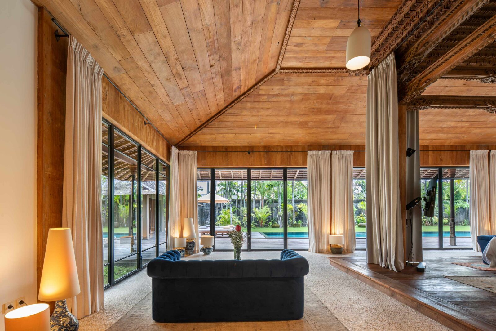 The blue sofa in the master suite, beside doors onto the garden